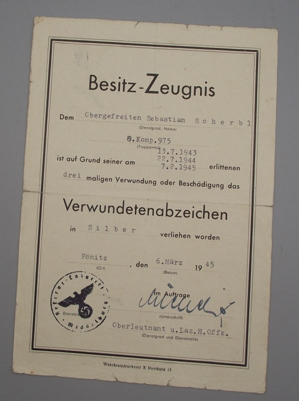 1945 Silver Wound Citation and POW Cert of Discharge.