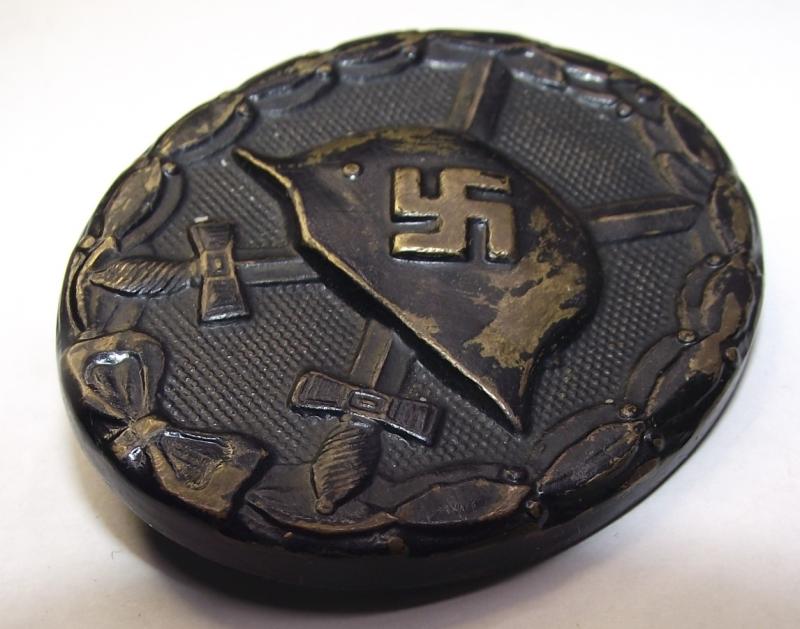 WW2 German Black Wound Bade. Brass Manufactured MM/118, August Menze & Sohn.