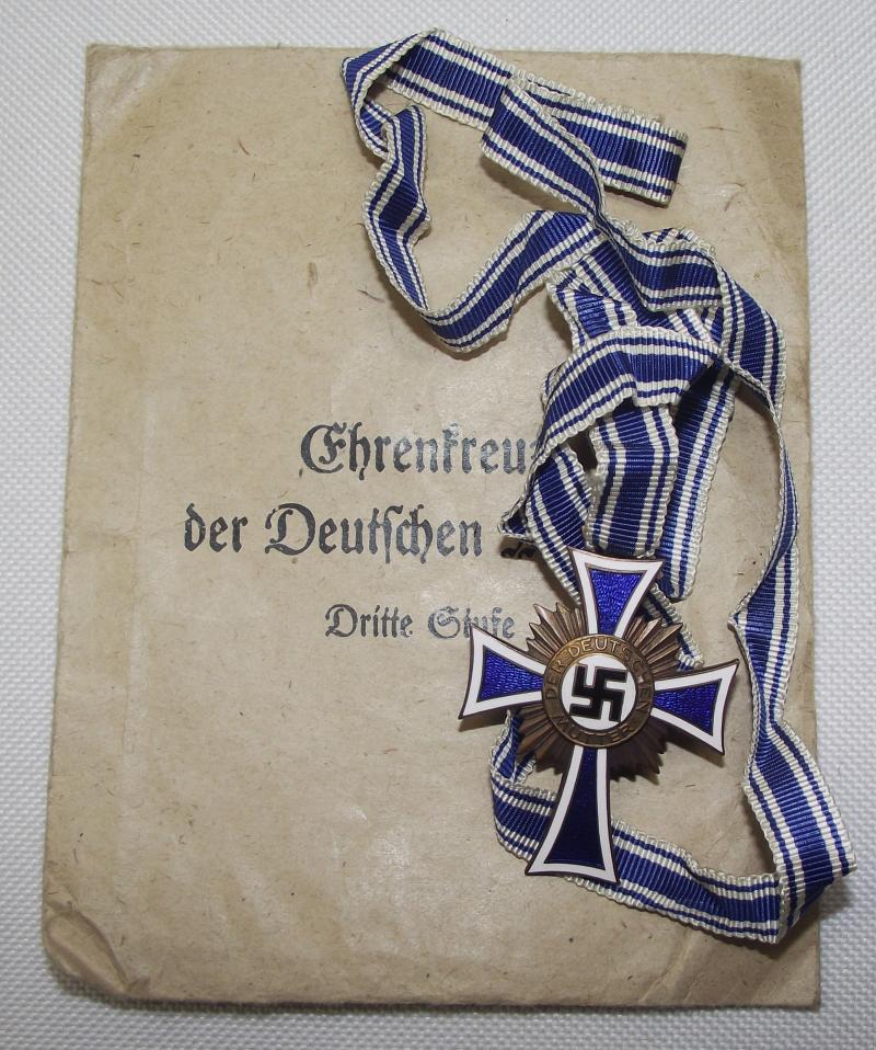 Bronze Mothers Cross with Paper Packet of Issue.