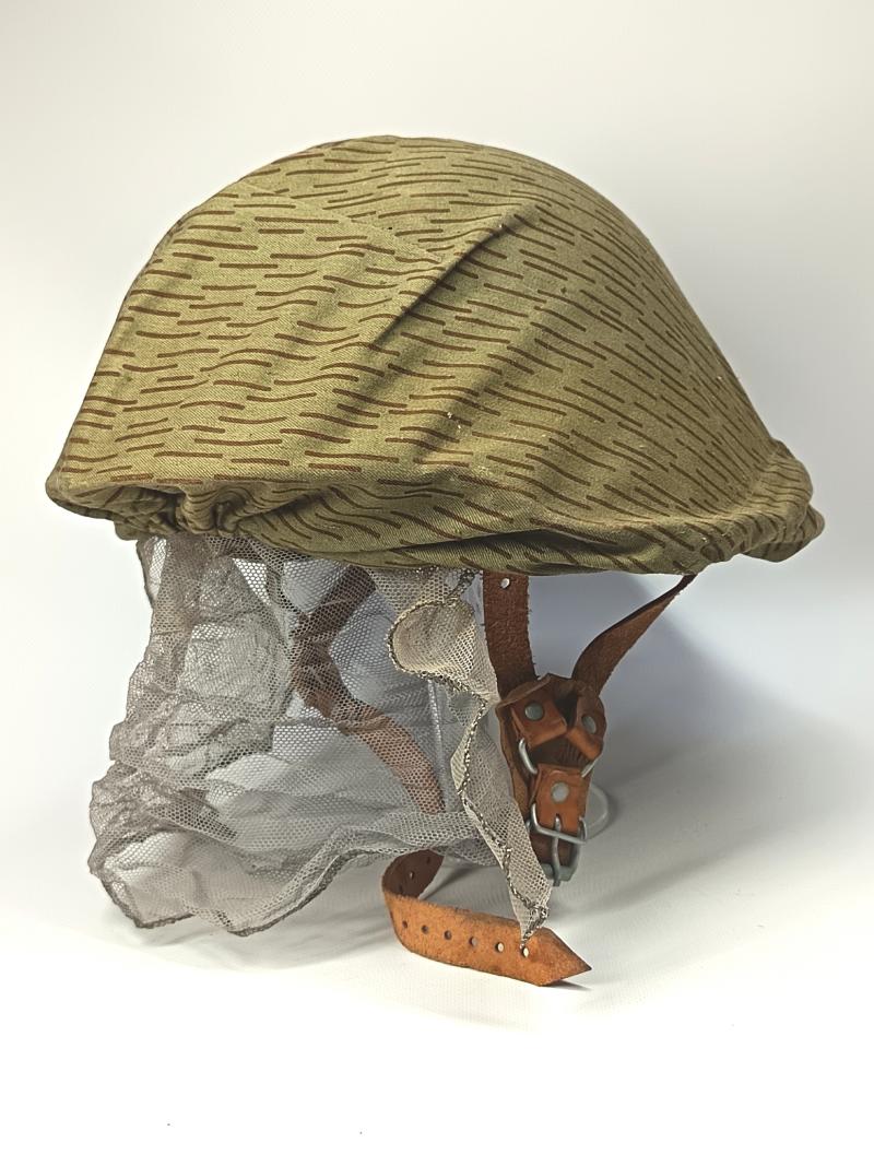 East German M56/66 Steel Helmet and Strictarn Cover.