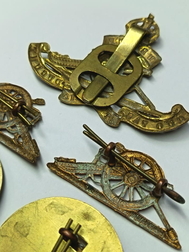 RA and Welch Regiment Brass Insignia.